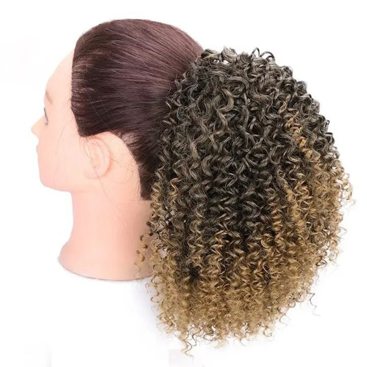 African drawstring small curly ponytail wig extension for Black women, ombre 1B/27 honey blonde kinky curly hairpiece with voluminous defined curls, adjustable drawstring attachment, natural textured protective updo, curly puff ponytail extension for everyday wear, parties, weddings and special occasions.