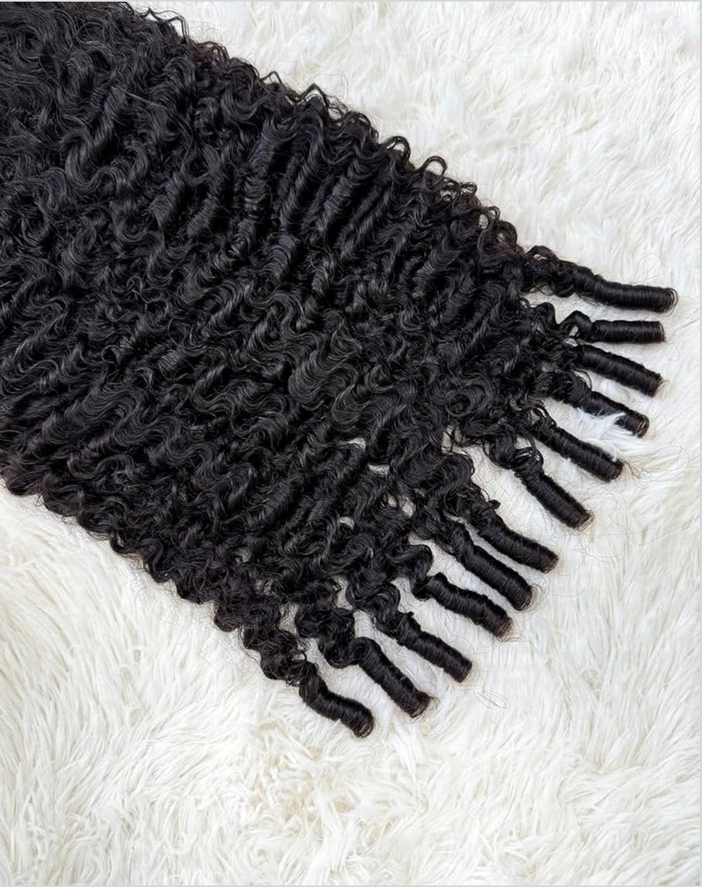 Black textured scarf with fringes on a white textured surface 100% Burmese Virgin Human Hair