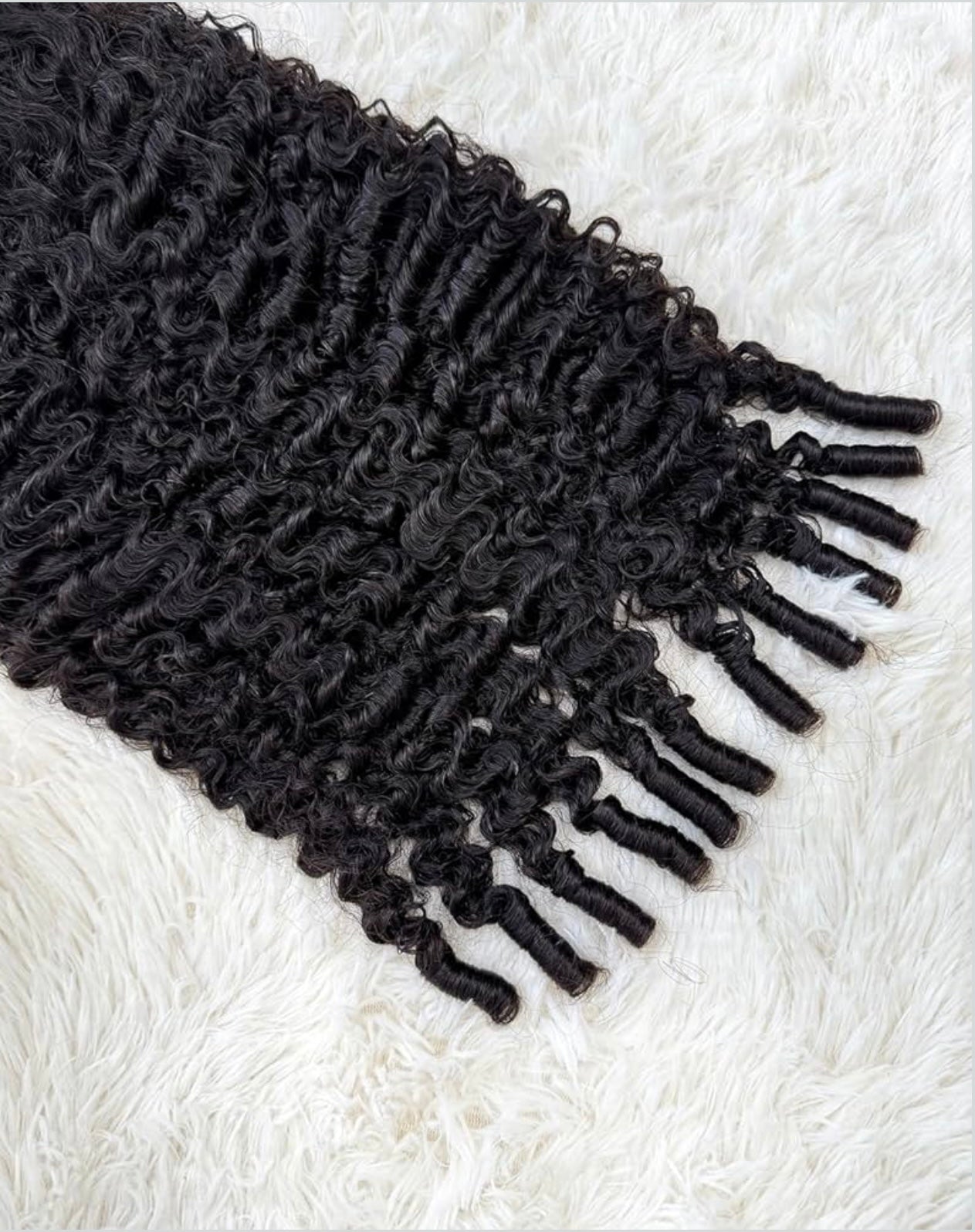 Black textured scarf with fringes on a white textured surface 100% Burmese Virgin Human Hair