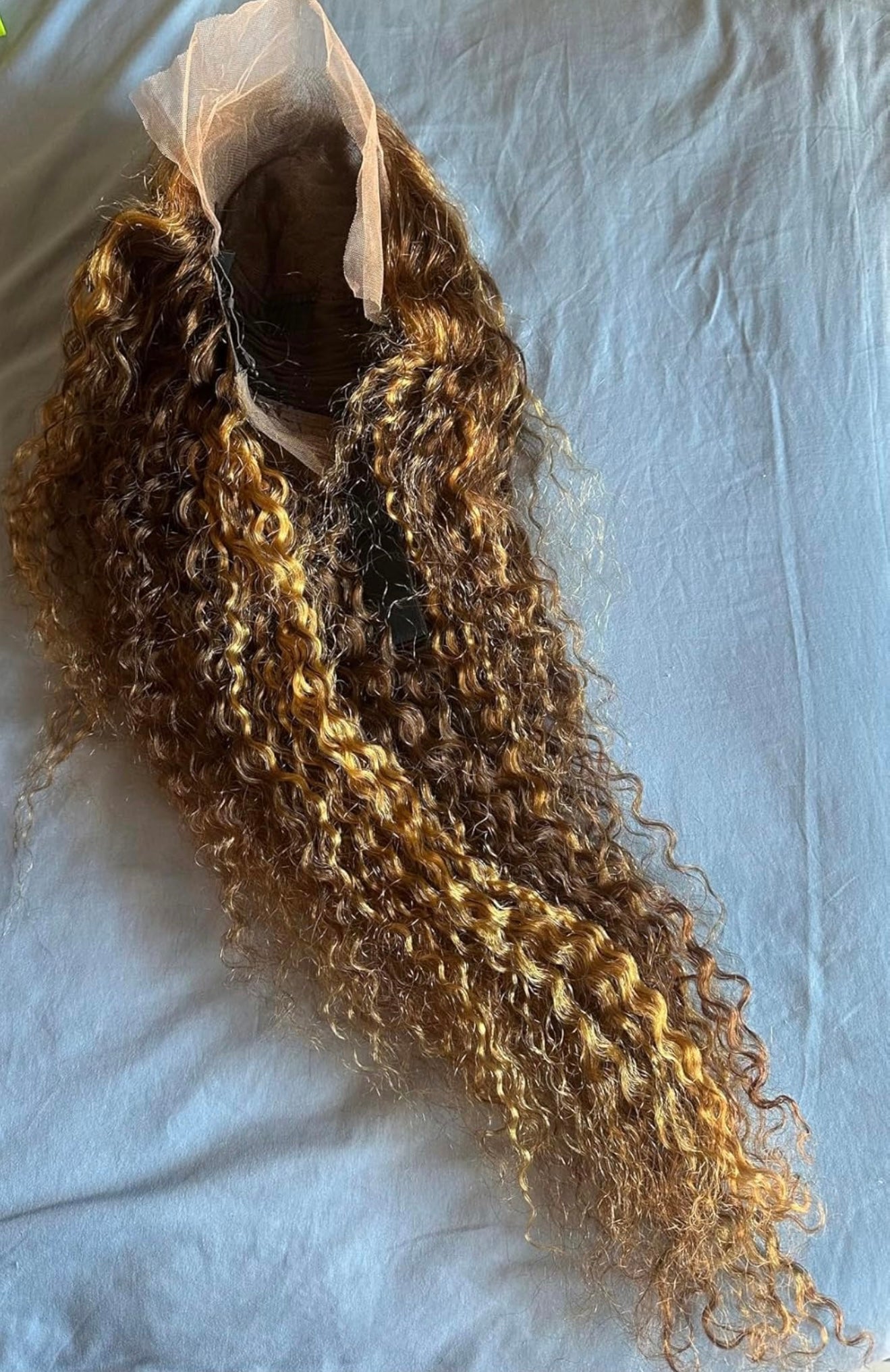Curly hair extensions on a white background 100% Unprocessed Brazilian Human Lace Front Wig Blonde Highlights 13x6 HD Deep Wave Glueless Lace Frontal Wigs