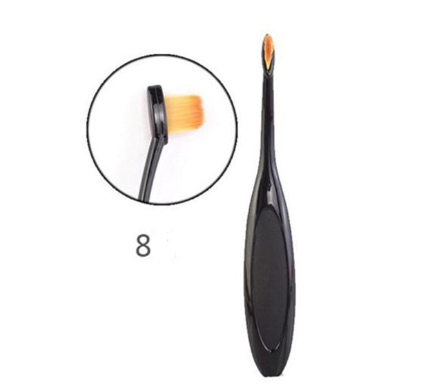 Black oval makeup brush with angled ultra-soft dense orange bristles and ergonomic handle for precise foundation, concealer, contouring and blending makeup application