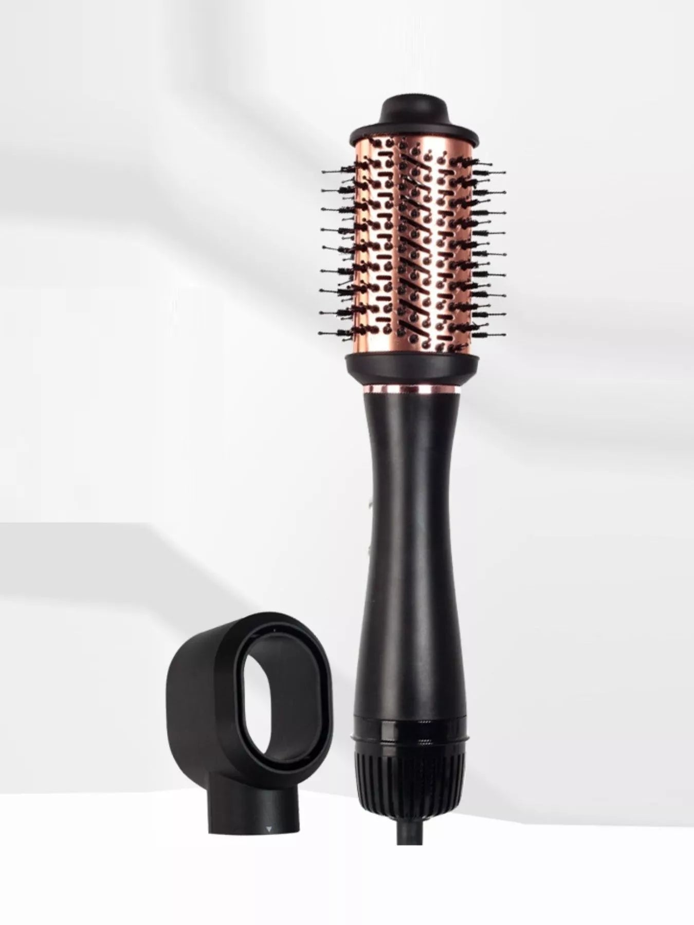 Fast Heating Hot Air Brush with rose gold vented barrel, heat-resistant bristles, black ergonomic handle and styling attachment for smoothing, straightening, volumizing, detangling and creating salon-quality blowouts on multiple hair types.