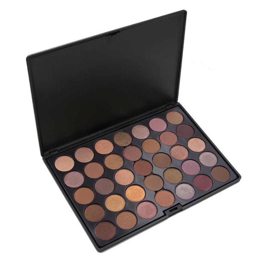 Makeup palette with various shades of eyeshadows on a white background