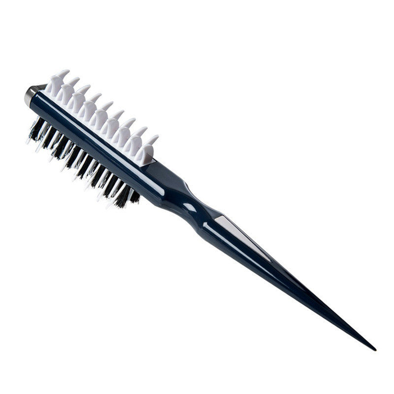 Navy blue hairbrush with white bristles on a white background