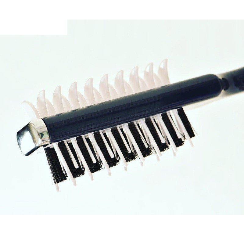 Hairbrush with black bristle head and white plastic handle on a light gray background