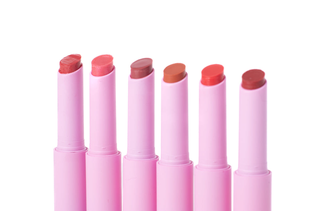 Lip Luv’d tinted lip balm set featuring six moisturizing lip colors in Sunkiss’d, Girly Guava, Blush’d, Spice, Blossom’d and Bashful shades in pink tubes.