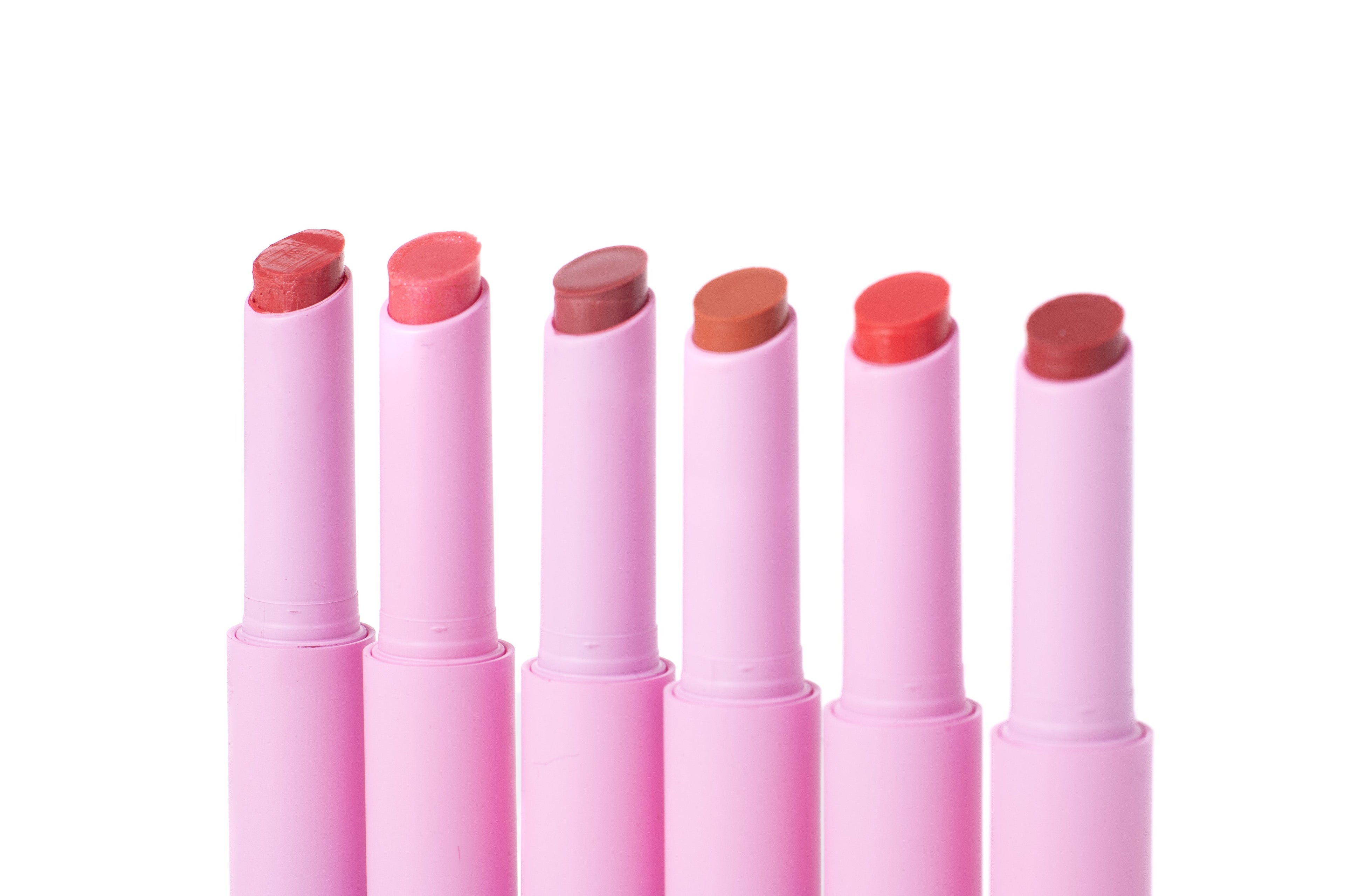 Lip Luv’d tinted lip balm set featuring six moisturizing lip colors in Sunkiss’d, Girly Guava, Blush’d, Spice, Blossom’d and Bashful shades in pink tubes.