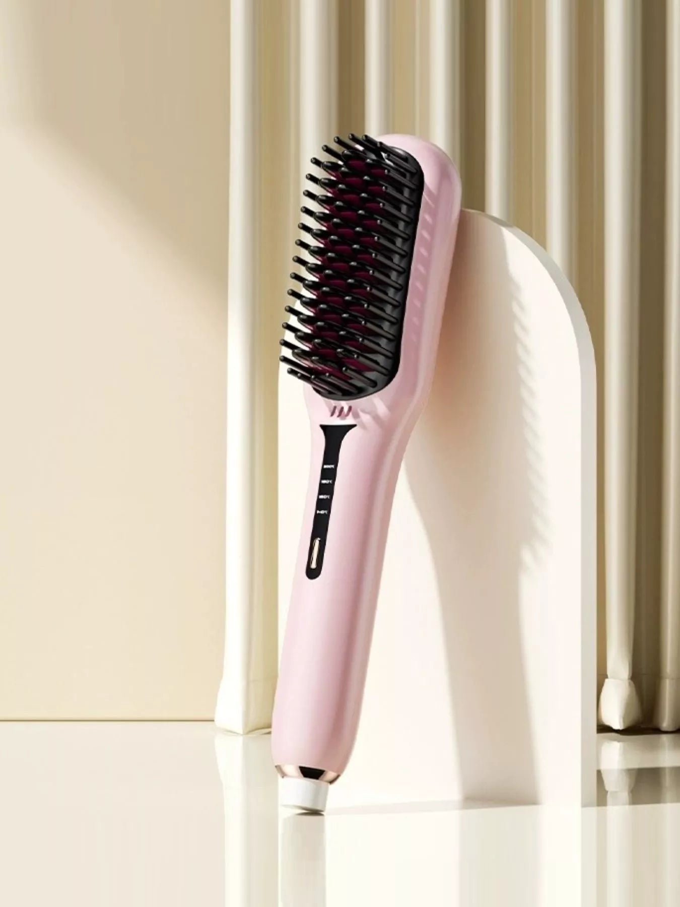 Blush pink fast-heating electric hair straightening comb with black heated bristles, ergonomic handle and adjustable temperature controls for smooth, sleek, frizz-free styling.