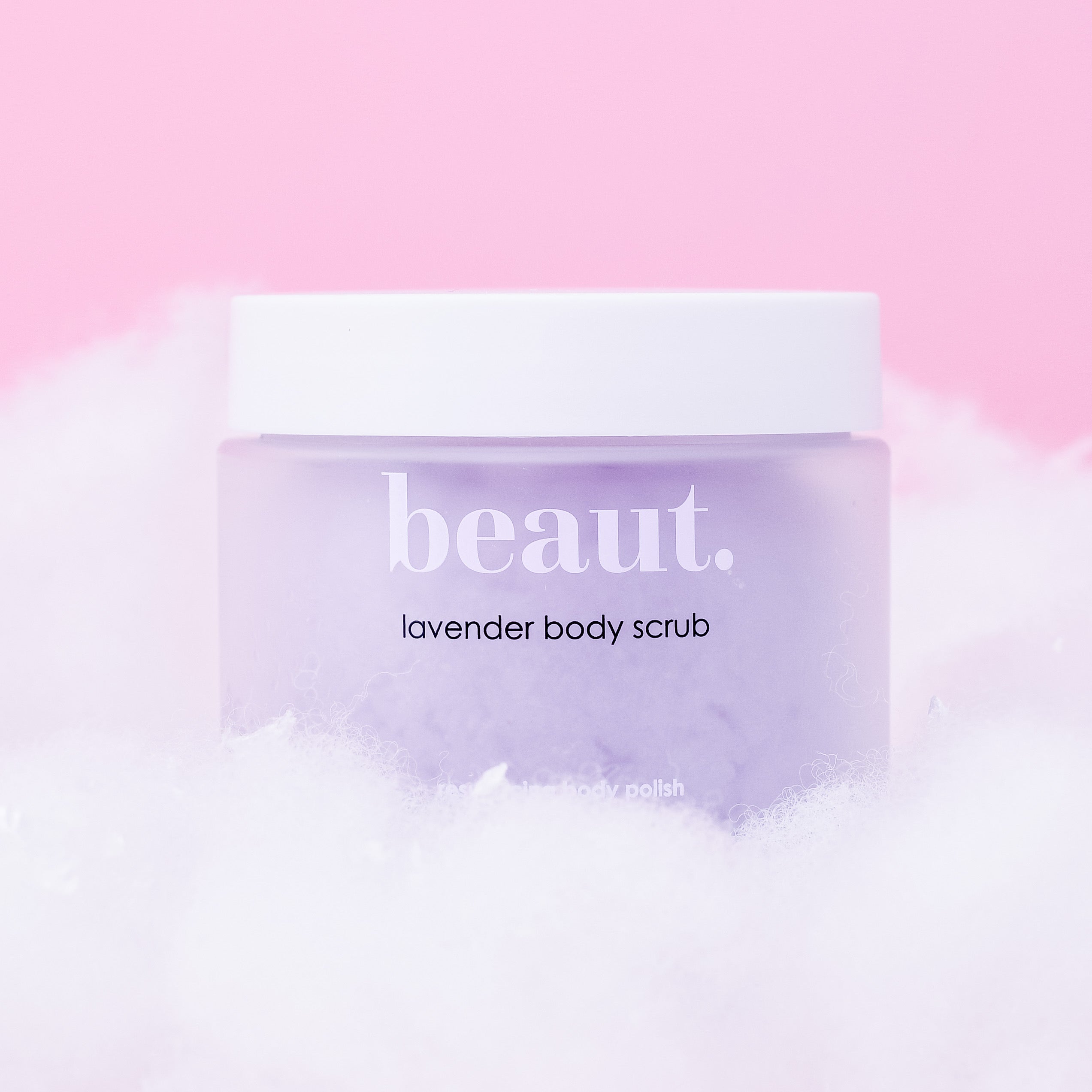 Beaut. Lavender Body Scrub – exfoliating body polish in a lavender jar with white lid, luxury skincare for smooth, soft, radiant skin