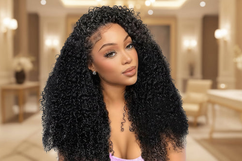 Woman with long, curly black hair in a well-lit room. Afro Kinky Curly 100% Human Hair Glueless Wig 5x5 Bleached Knots Wear Go Wig Pre Cut HD Lace Front Wig