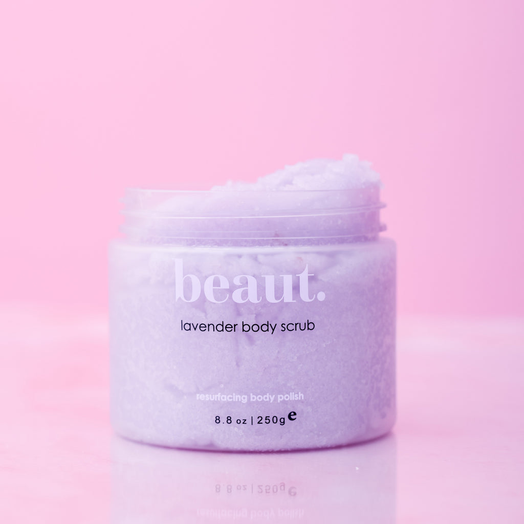 Beaut. Lavender Body Scrub – resurfacing exfoliating body polish, 8.8 oz luxury skincare scrub for smooth, soft, radiant skin on pink background