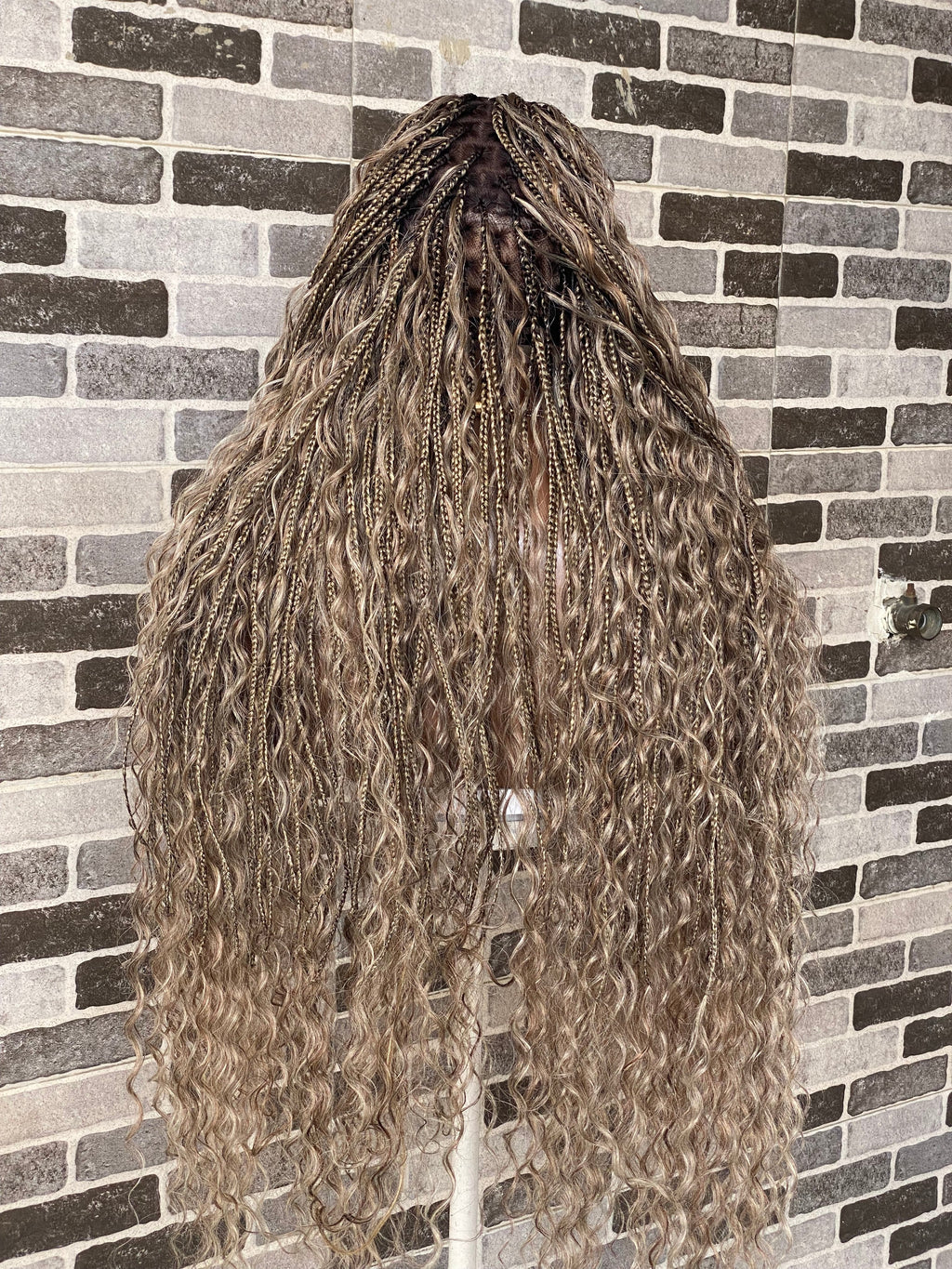 Person with long, wavy hair against a tiled wall background. Bohemian Knotles custom color Full lace wig (Mix color)