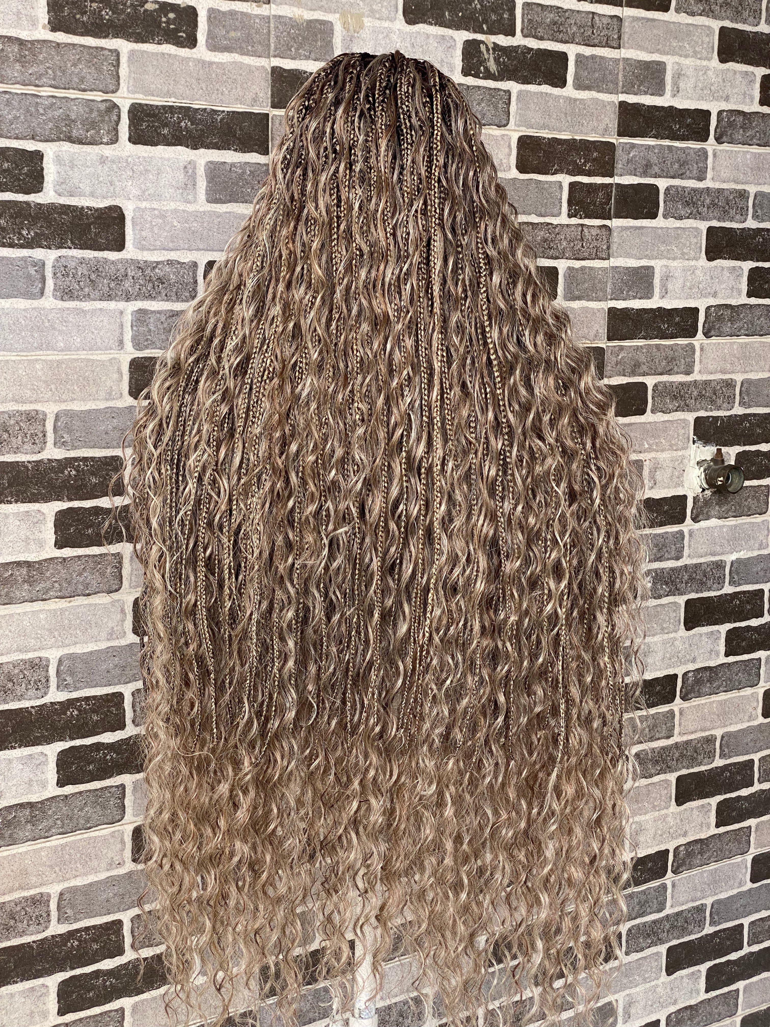 Long, wavy hair styled in a 这种方式 against a brick wall. Bohemian Knotles custom color Full lace wig (Mix color)