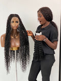 Person holding a set of hair extensions next to a mannequin with long, wavy hair. Bohemian humanhair Knotless-Ready to ship (Tara) Bohemian Human Hair Knotless-Ready to ship (Tara) 100% Human Hair and Stretchable HD Full Lace Cap
