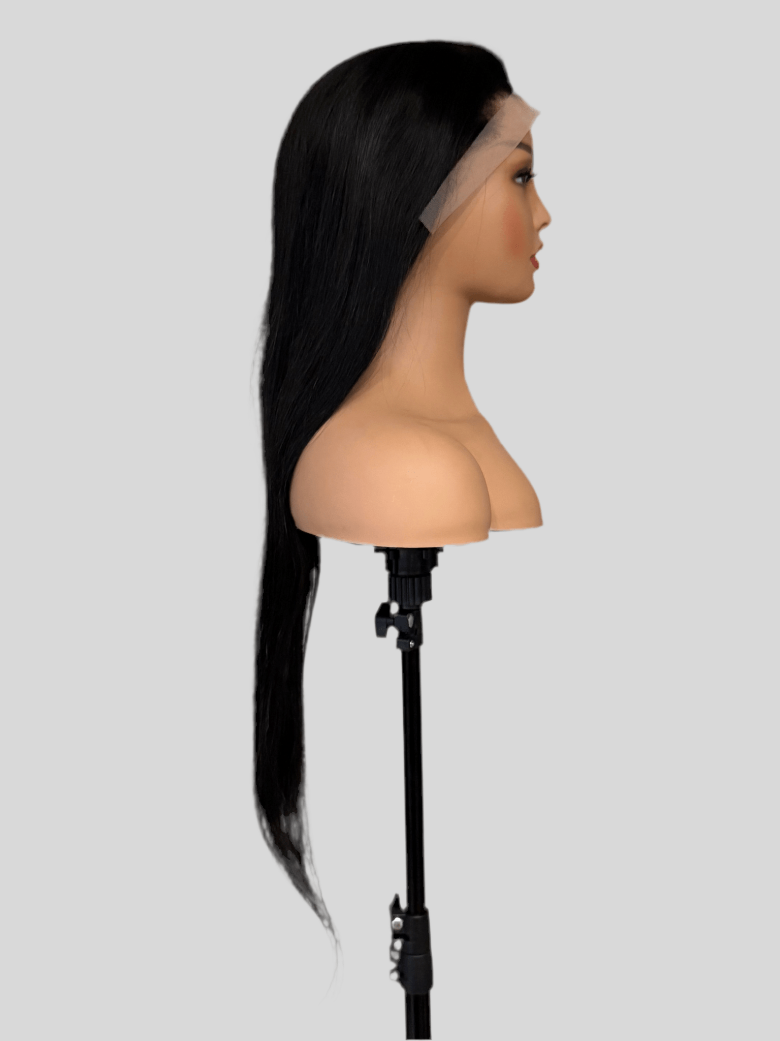 Black wig on a mannequin head with a gray background brazilian straight wig, brazilian straight lace front wig, straight lace front wig, straight human hair wig, natural black wig, black lace front wig, human hair wig, 100% human hair wig, glueless wig, ready to wear wig, natural hairline wig, realistic lace front wig, premium human hair wig, luxury wig, long straight wig, long black wig, heat safe wig, everyday wig, date night wig, photo ready wig
