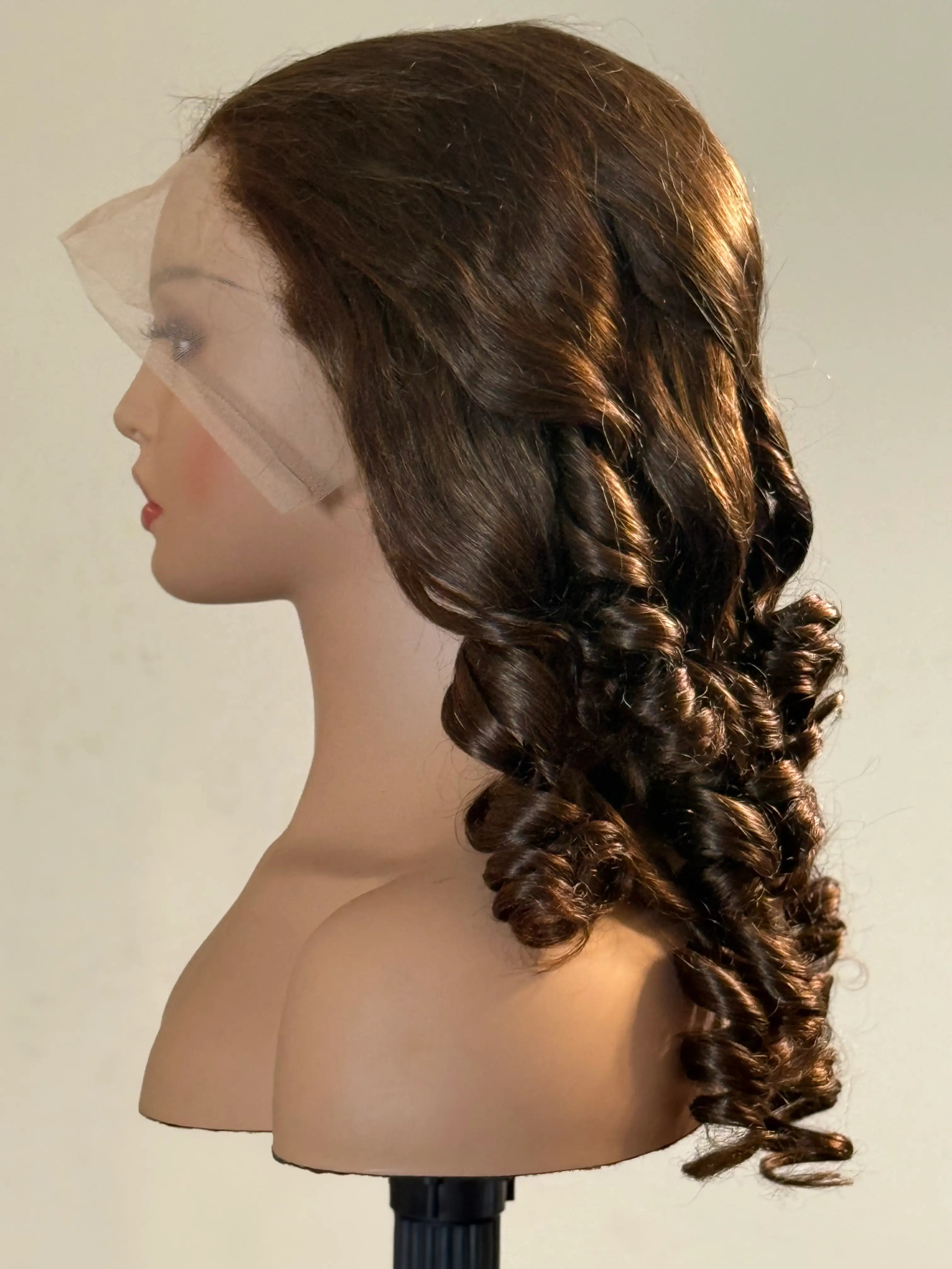 Mannequin head with a brown wig styled in an intricate braid on a plain background brown sugar bounce, chocolate brown lace front wig, chocolate brown human hair wig, brown lace front wig, brown human hair wig, brunette wig, brunette lace front wig, chocolate wig, rich brown wig, mocha brown wig, caramel brown wig, warm brown wig, chocolate brown hair wig, long loose wave wig, loose wave human hair wig, loose wave lace wig, luxury brown wig, premium human hair wig, natural part wig, realistic lace front wig