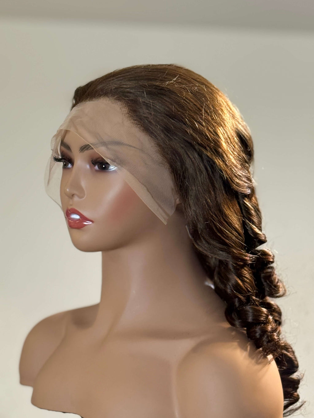 Mannequin head with a brown wig styled in a braid on a plain background brown sugar bounce, chocolate brown lace front wig, chocolate brown human hair wig, brown lace front wig, brown human hair wig, brunette wig, brunette lace front wig, chocolate wig, rich brown wig, mocha brown wig, caramel brown wig, warm brown wig, chocolate brown hair wig, long loose wave wig, loose wave human hair wig, loose wave lace wig, luxury brown wig, premium human hair wig, natural part wig, realistic lace front wig, seamless 