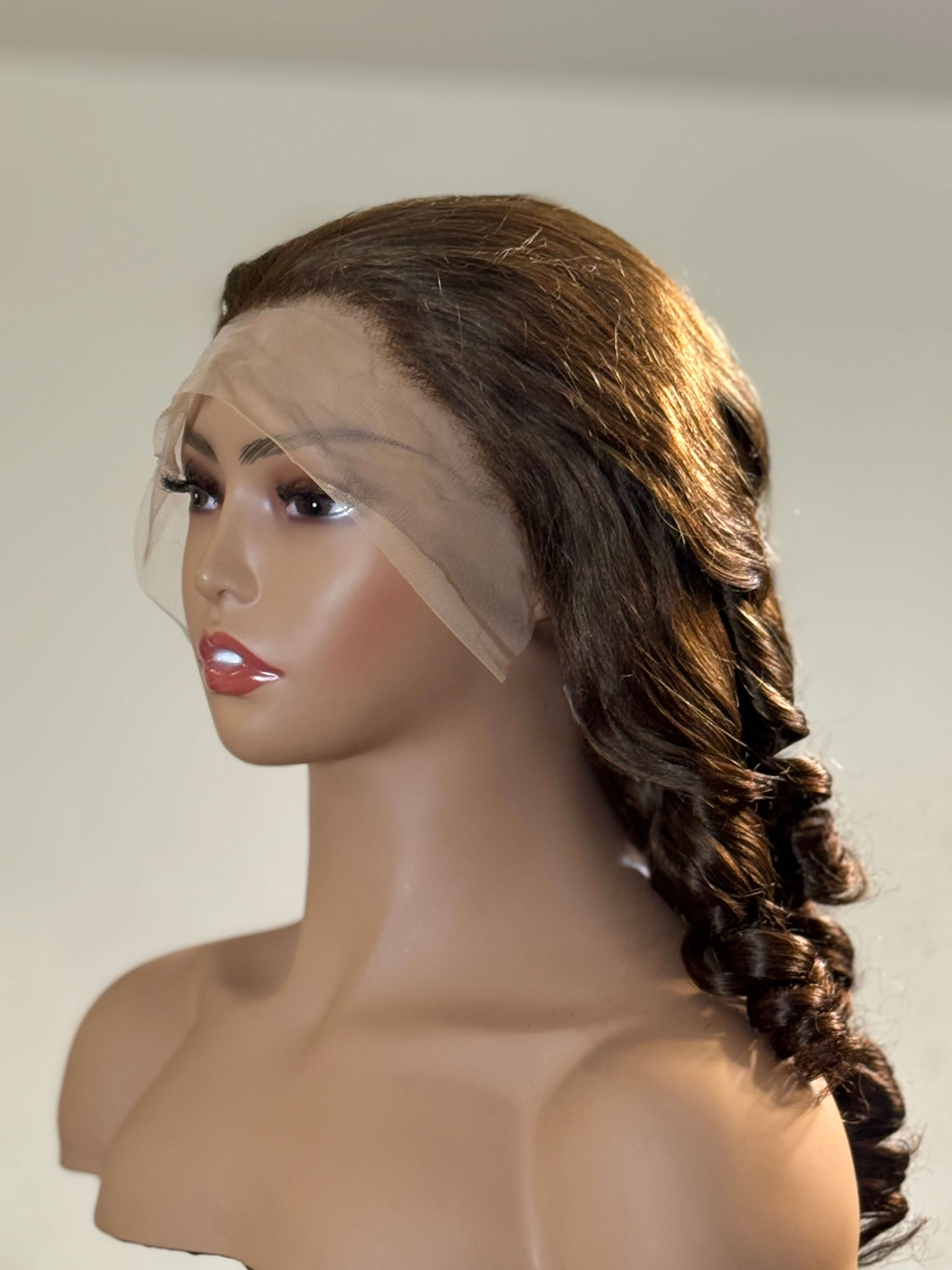 Mannequin head with a brown wig styled in a braid on a plain background brown sugar bounce, chocolate brown lace front wig, chocolate brown human hair wig, brown lace front wig, brown human hair wig, brunette wig, brunette lace front wig, chocolate wig, rich brown wig, mocha brown wig, caramel brown wig, warm brown wig, chocolate brown hair wig, long loose wave wig, loose wave human hair wig, loose wave lace wig, luxury brown wig, premium human hair wig, natural part wig, realistic lace front wig, seamless 