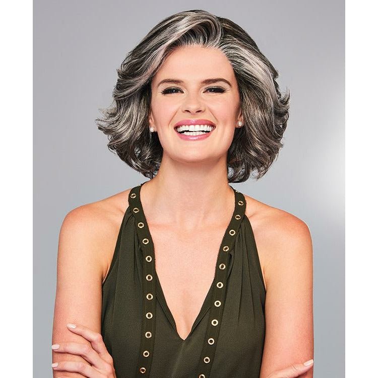 Woman with styled hair against a gray background. Eva Gabor High Impact Wig Hairpiece New With Tags