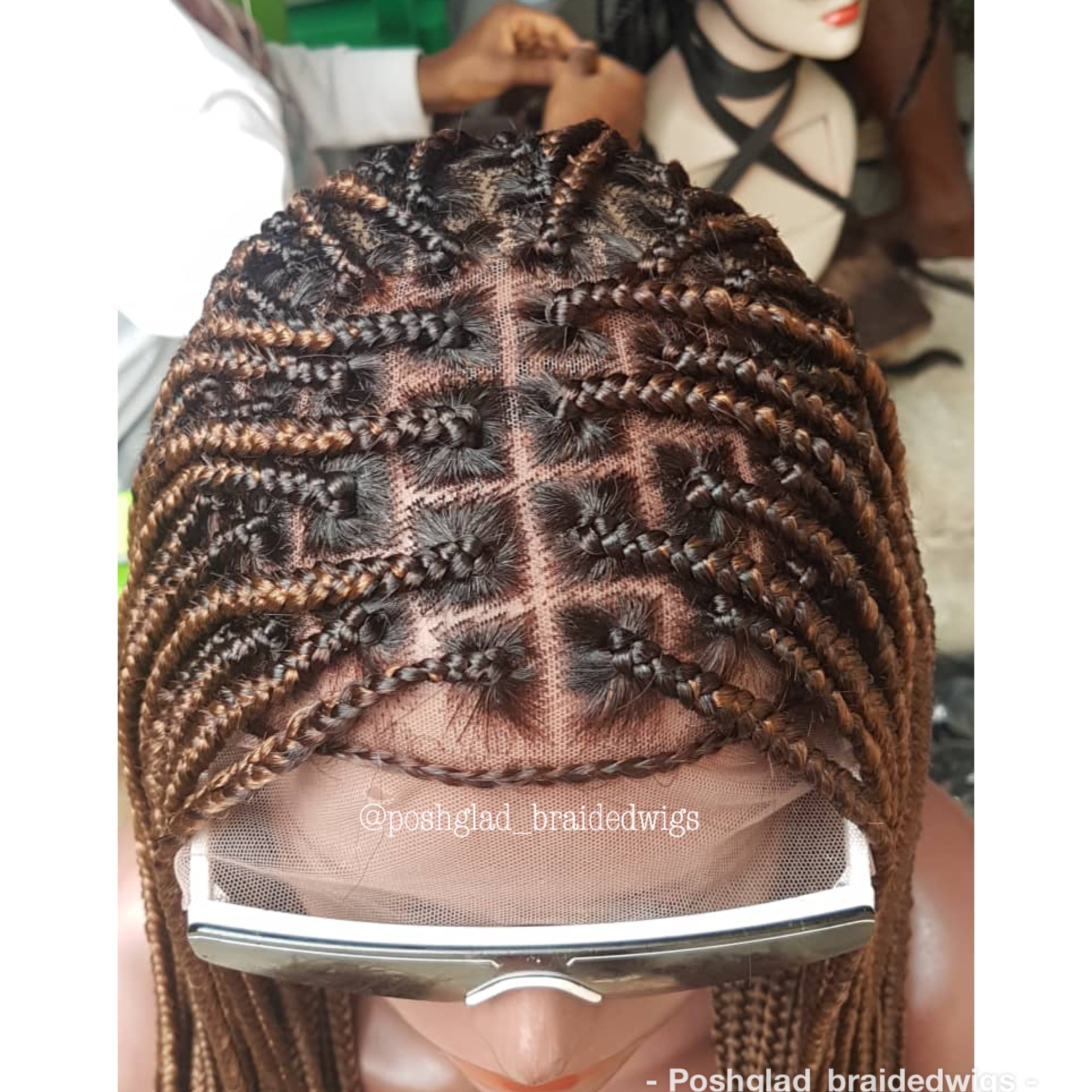Close-up of braided hair with a comb, branded 'Poshglad braidedwigs'. Knotless Braid Wig,  100% Human Hair Dark Honey Blond, Swiss Full Lace, Glueless - Helen