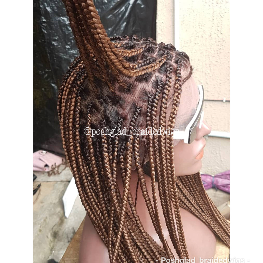 Person with braided hair wearing sunglasses, with a blurred background. Knotless Braid Wig,  100% Human Hair Dark Honey Blond, Swiss Full Lace, Glueless - Helen