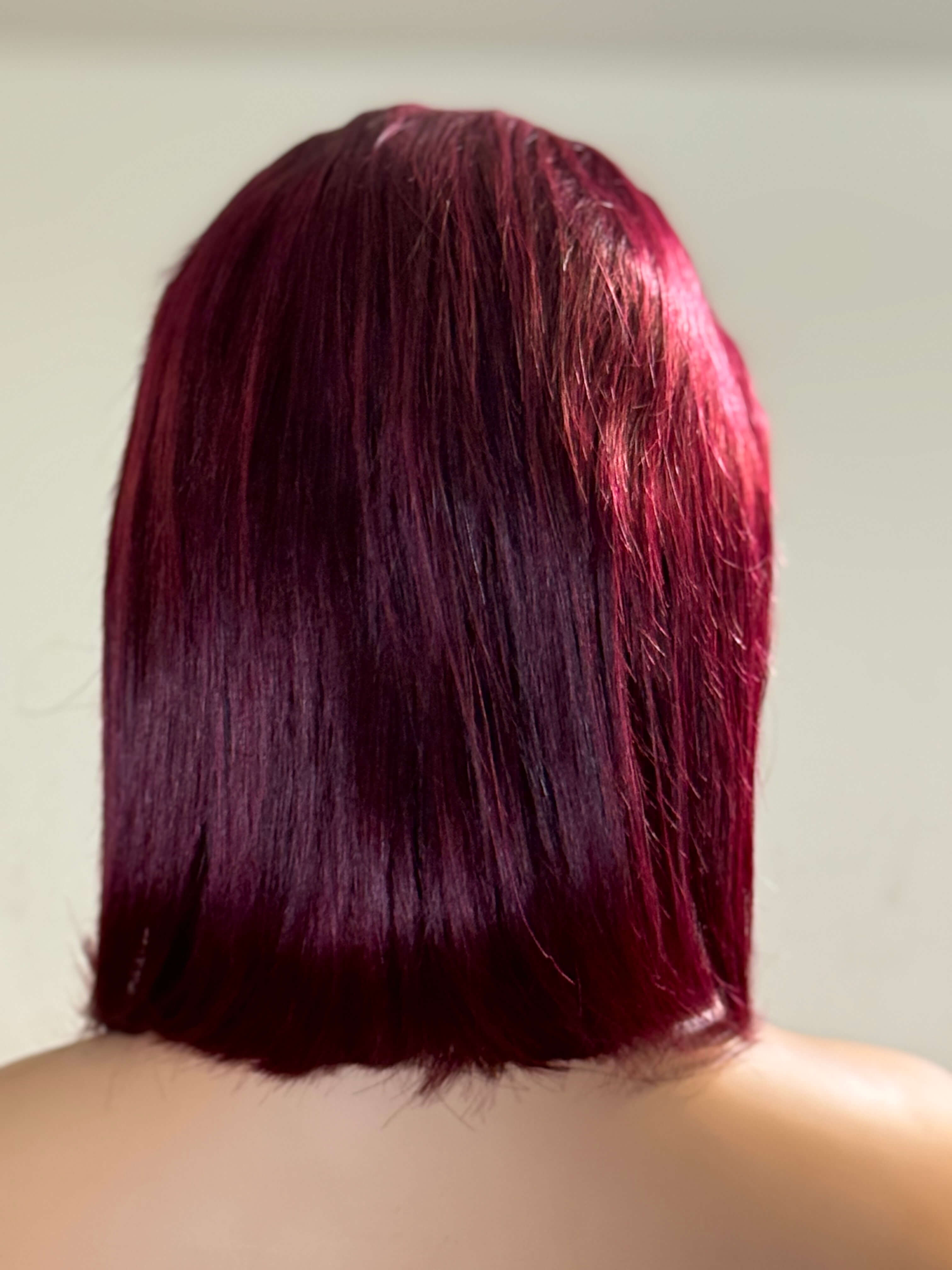 Reddish-brown hair from behind on a plain background. burgundy wig, burgundy red wig, burgundy lace front wig, burgundy human hair wig, wine red wig, wine color wig, red lace front wig, red human hair wig, red bob wig, burgundy bob wig, burgundy lace wig, burgundy human hair bob wig, straight bob wig, straight lace front wig, straight human hair wig, human hair bob wig, lace front bob wig, bob lace wig, chic bob wig, sleek bob wig, short human hair wig, short lace front wig, short wig, bob hairstyle wig bob