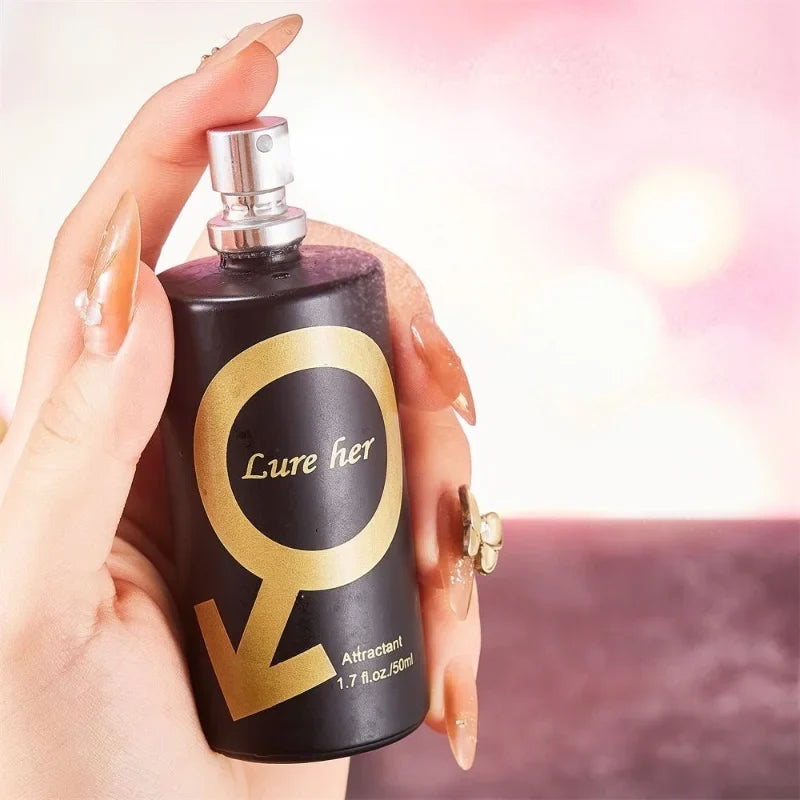 Perfume bottle labeled 'Lure her' held by a hand with a blurred background