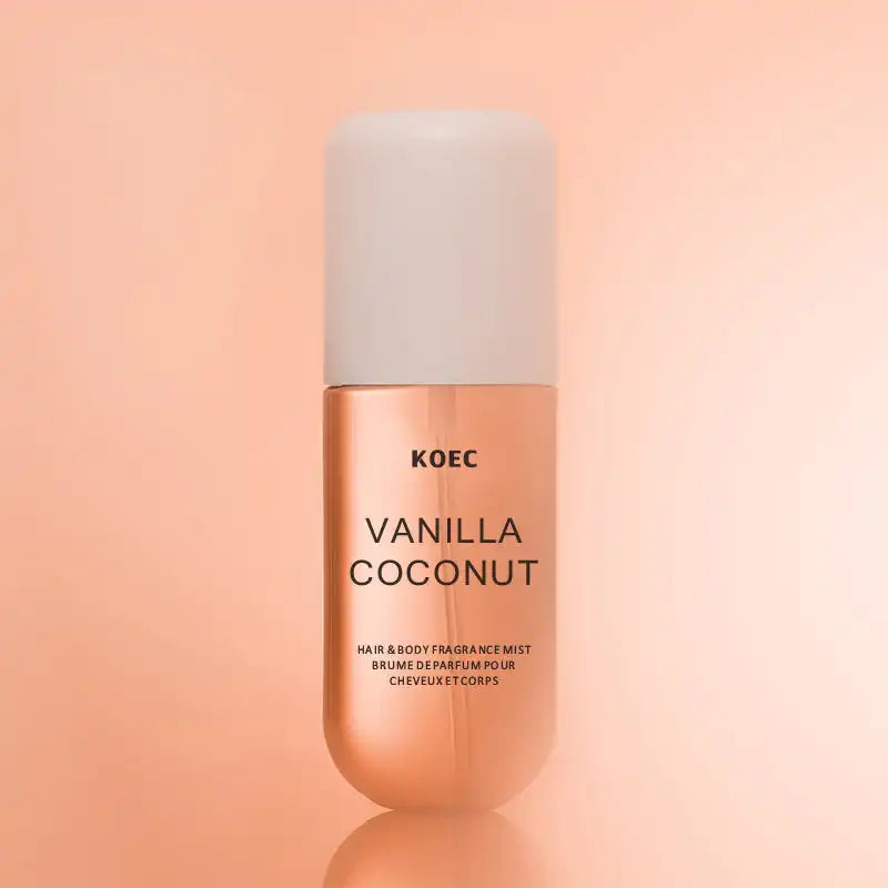 KOEC Vanilla Coconut hair and body fragrance mist on a peach background