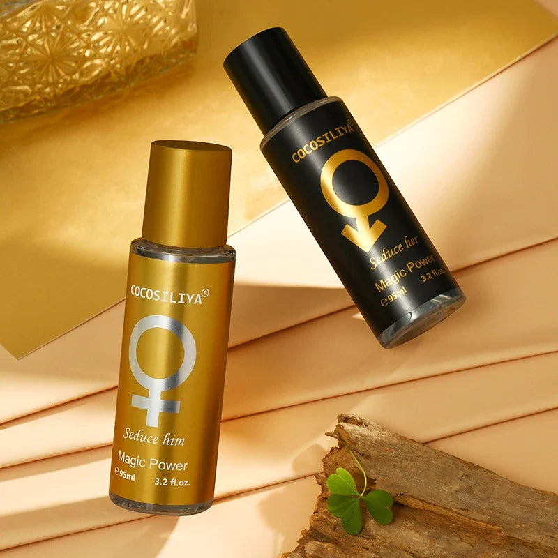 COCOSILIYA Seduce Her & Seduce Him pheromone perfume oils in elegant gold and black bottles, long-lasting unisex attraction fragrances displayed on a luxurious gold background.