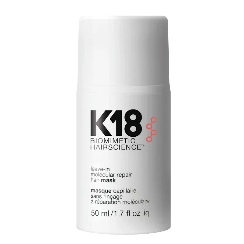 A white cylindrical bottle of K18 Biometric Hairscience leave-in molecular repair hair mask, featuring black and pink text on a clean white background.