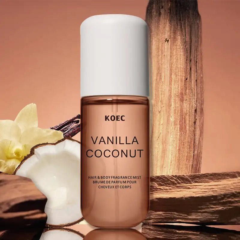 KOEC Vanilla Coconut hair and body fragrance mist with coconut and vanilla elements on a warm background