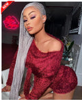 Woman in a red outfit with silver braids in a room with a neon sign. cornrow braid wig, cornrow braided wig, glueless braided wig, glueless lace wig, HD lace braided wig, HD lace wig, full lace braided wig, full lace wig, human hair braided wig, human hair wig, braided wig, braided wig, lemonade braid wig, lemonade braids wig, side part braided wig, side part wig, hand braided wig, handmade braided wig, handcrafted wig, premium braided wig, luxury braided wig, luxury wig, baby hair wig, gray wig baby hairs