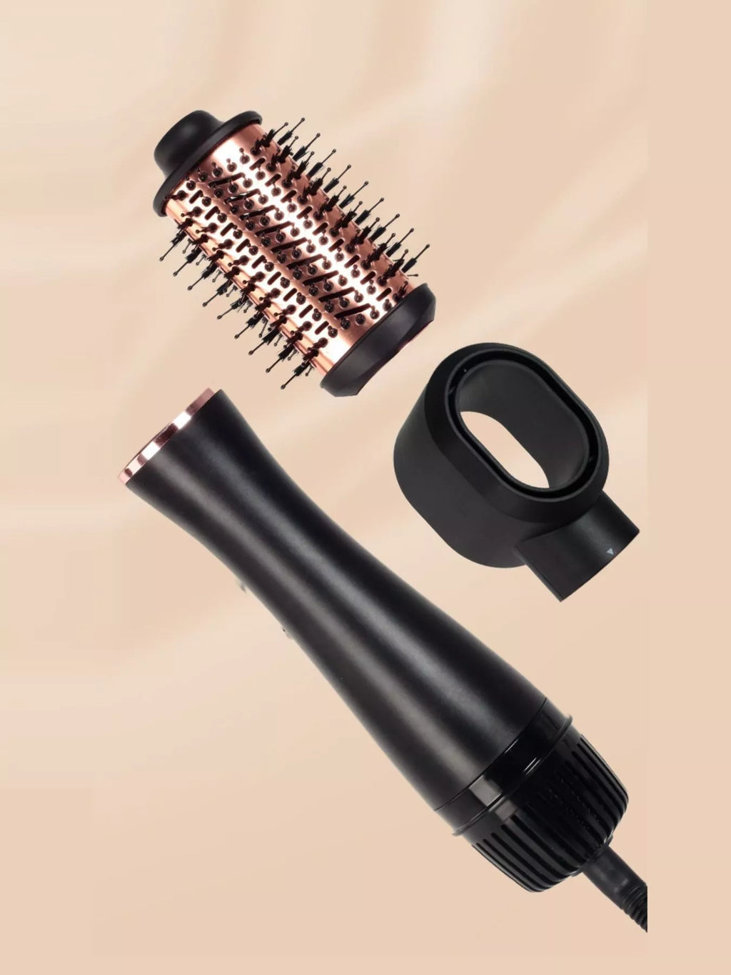 Fast Heating Hot Air Brush with detachable round volumizing brush and styling nozzle attachments in black and rose gold, one-step blow dryer brush for smoothing, straightening, adding volume, reducing frizz and creating salon-style blowouts at home.