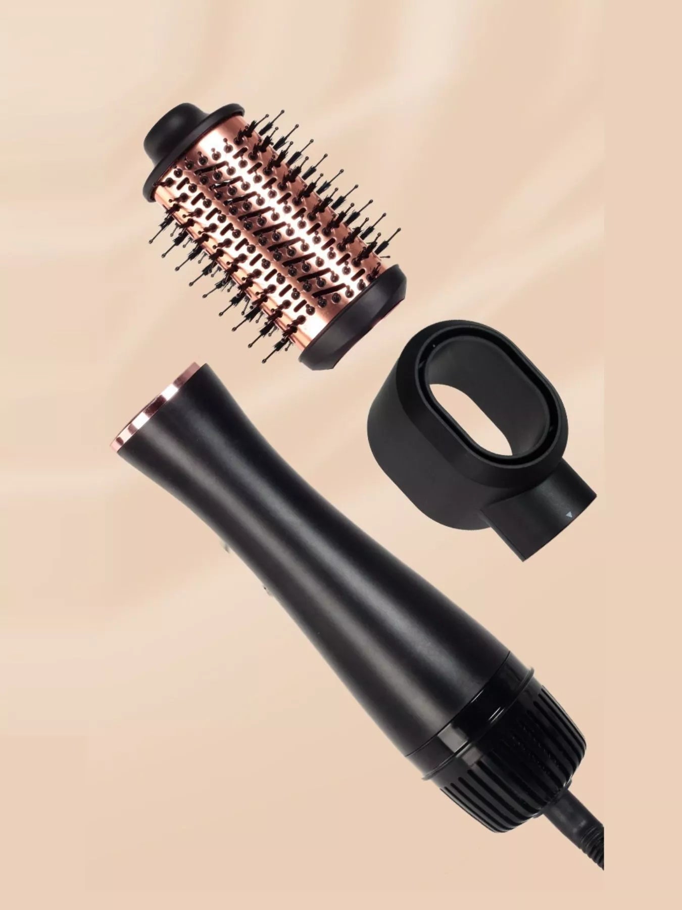 Fast Heating Hot Air Brush with detachable round volumizing brush and styling nozzle attachments in black and rose gold, one-step blow dryer brush for smoothing, straightening, adding volume, reducing frizz and creating salon-style blowouts at home.