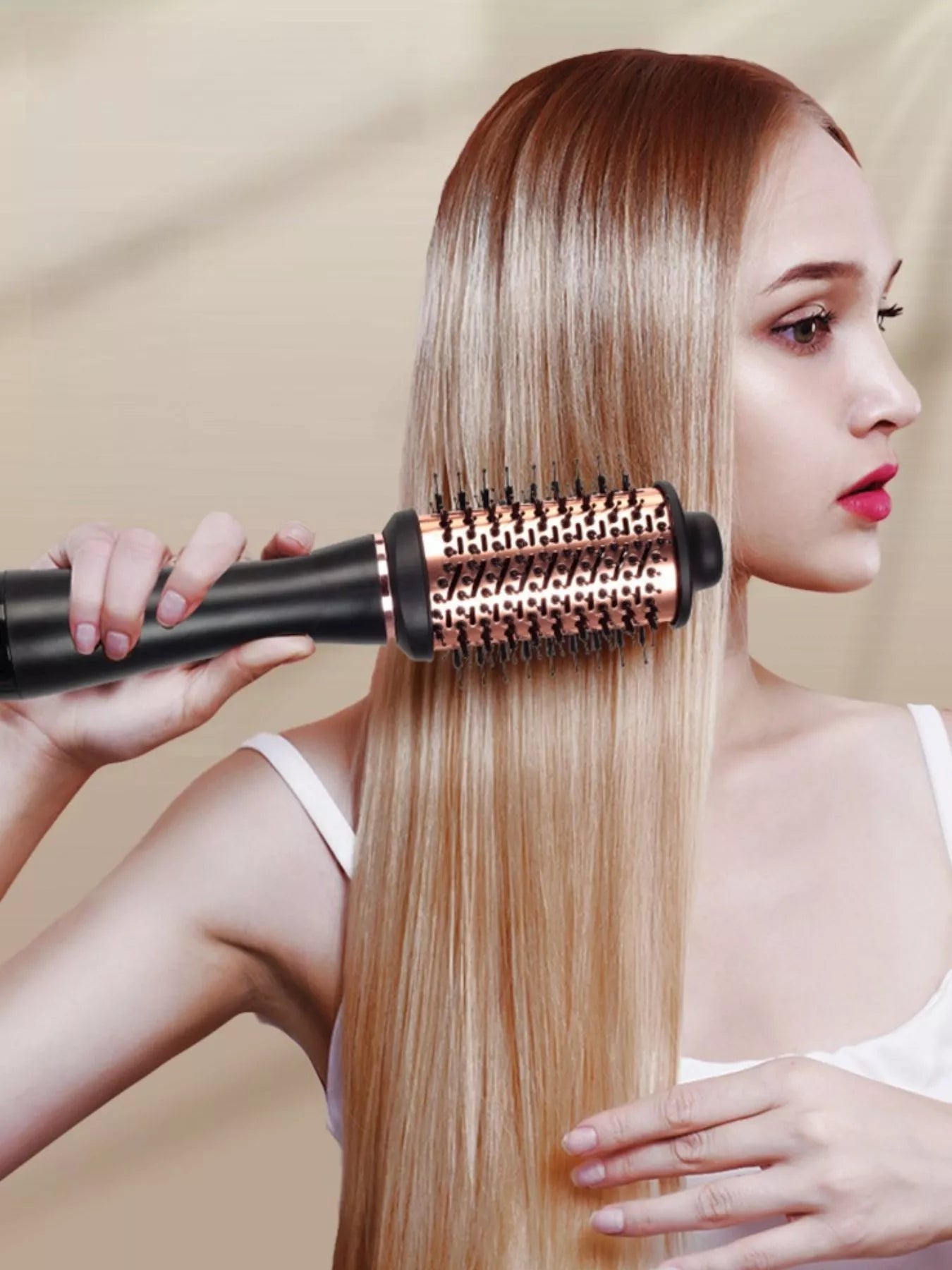 Fast heating hot air brush styling long straight blonde hair for smooth, sleek, salon-quality results, featuring a round heated brush for drying, straightening, smoothing, volumizing, and styling hair at home.