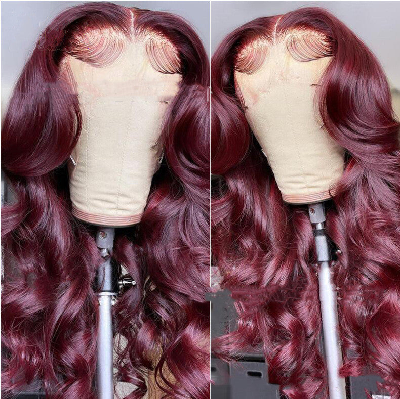 Red wavy hair wig on a mannequin head with a plain background. Wine Red Lace Front Wig – Long Curly Burgundy Synthetic Hair, Glamorous Natural Look