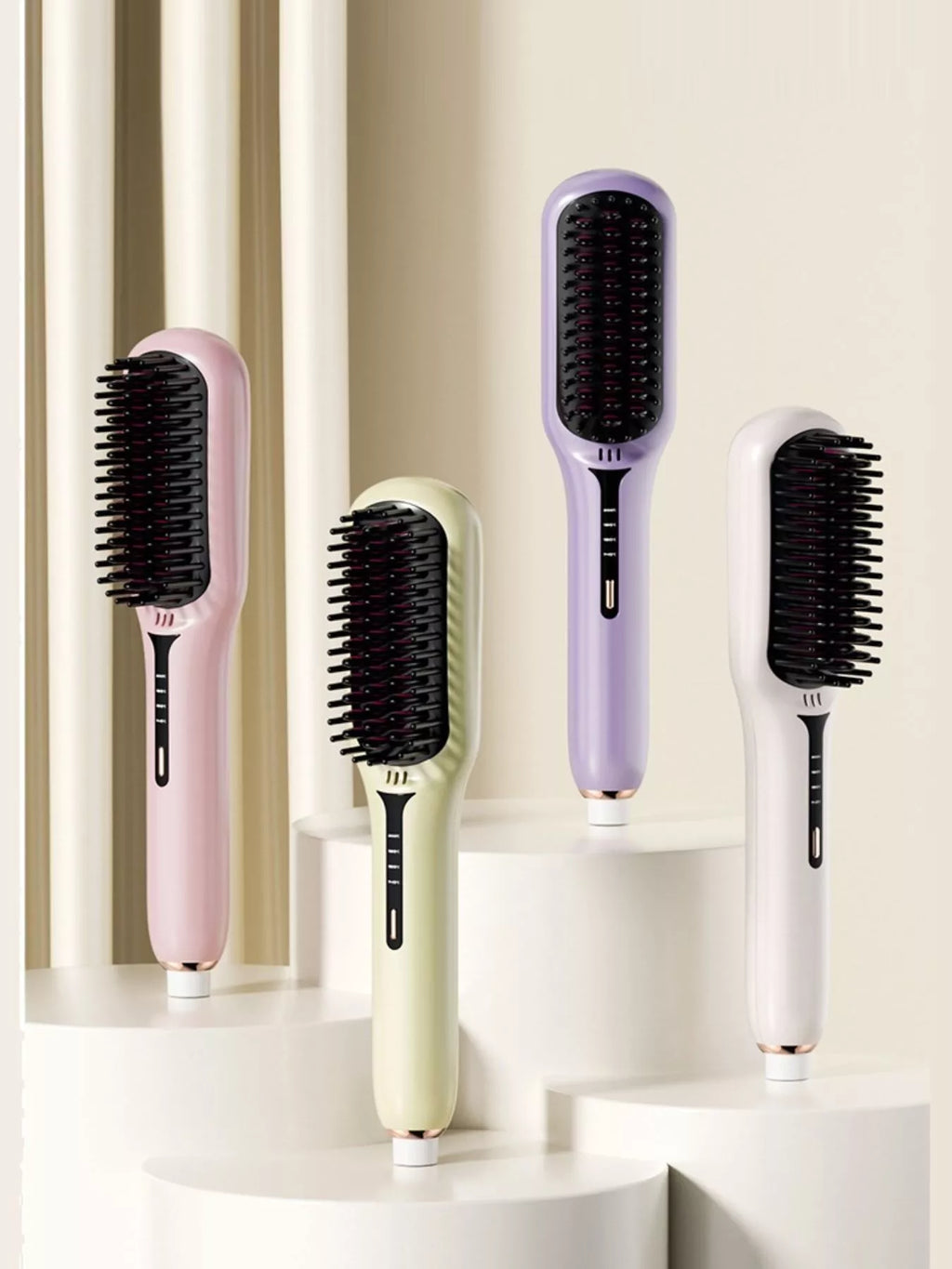 Four fast-heating electric hair straightening brushes in blush pink, ivory, lavender and sage with black heated bristles, ergonomic handles and temperature controls for smooth, sleek styling.