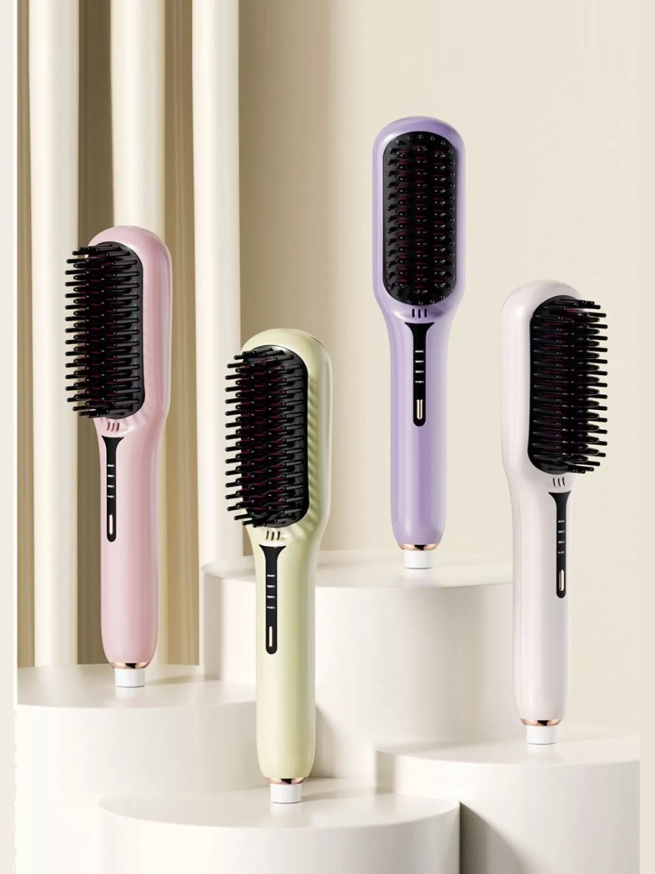 Four fast-heating electric hair straightening brushes in blush pink, ivory, lavender and sage with black heated bristles, ergonomic handles and temperature controls for smooth, sleek styling.