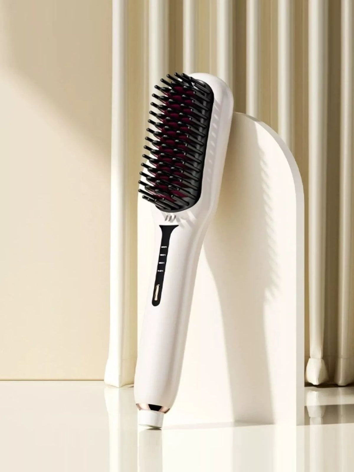Ivory fast-heating electric hair straightening brush with black heated bristles, ergonomic handle and adjustable temperature controls for smooth, sleek, frizz-free hair styling.