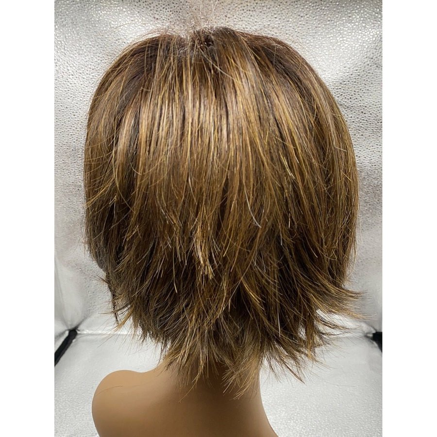 A short layered wig with ash brown and blonde highlights, shown from the back on a mannequin head against a textured light gray backdrop.