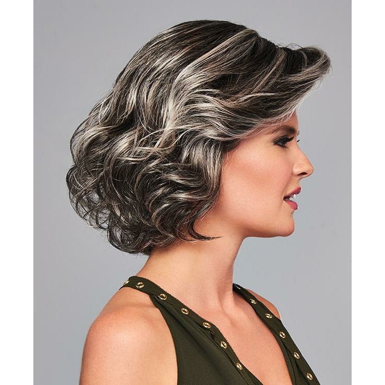 Woman with styled hair against a gray background. Eva Gabor High Impact Wig Hairpiece New With Tags