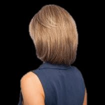 A person shown from the back wearing a shoulder-length layered bob wig with layered blonde and brown tones, against a solid black background.