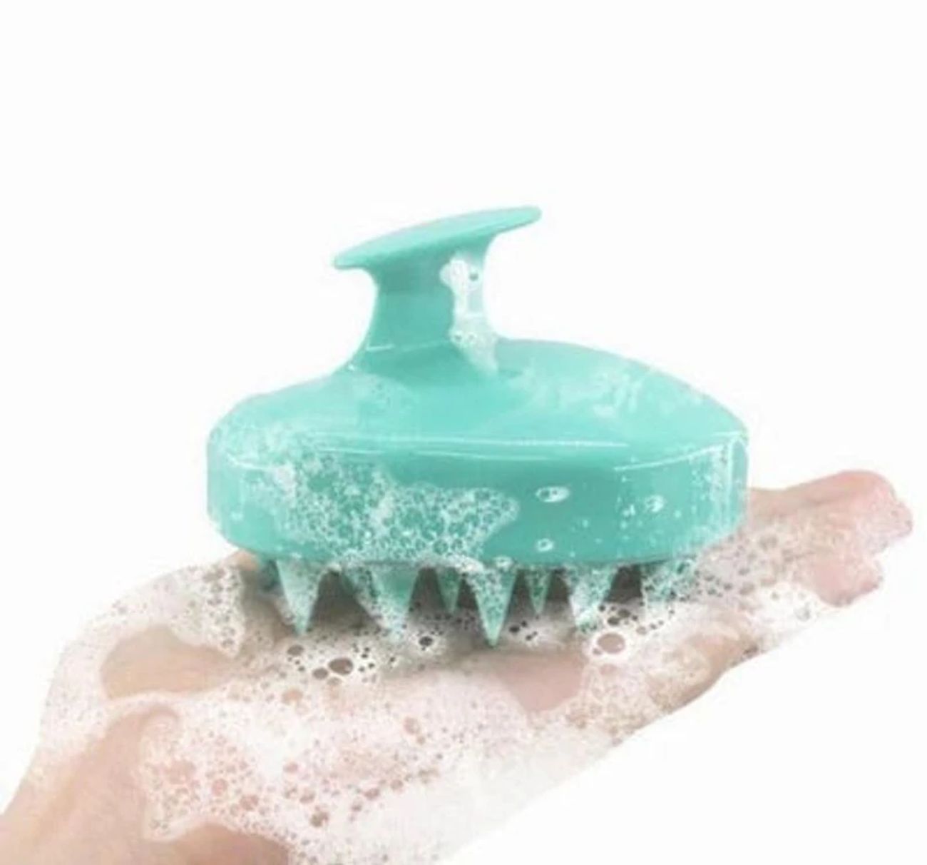Turquoise silicone scalp massager shampoo brush with soft bristles and ergonomic handle for deep cleansing, exfoliating and scalp care.