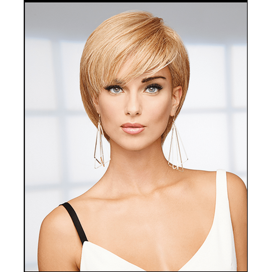 A blonde short pixie wig with layered bangs and side-swept bangs, modeled on a woman wearing a white top and long dangling earrings against a soft light gray background.