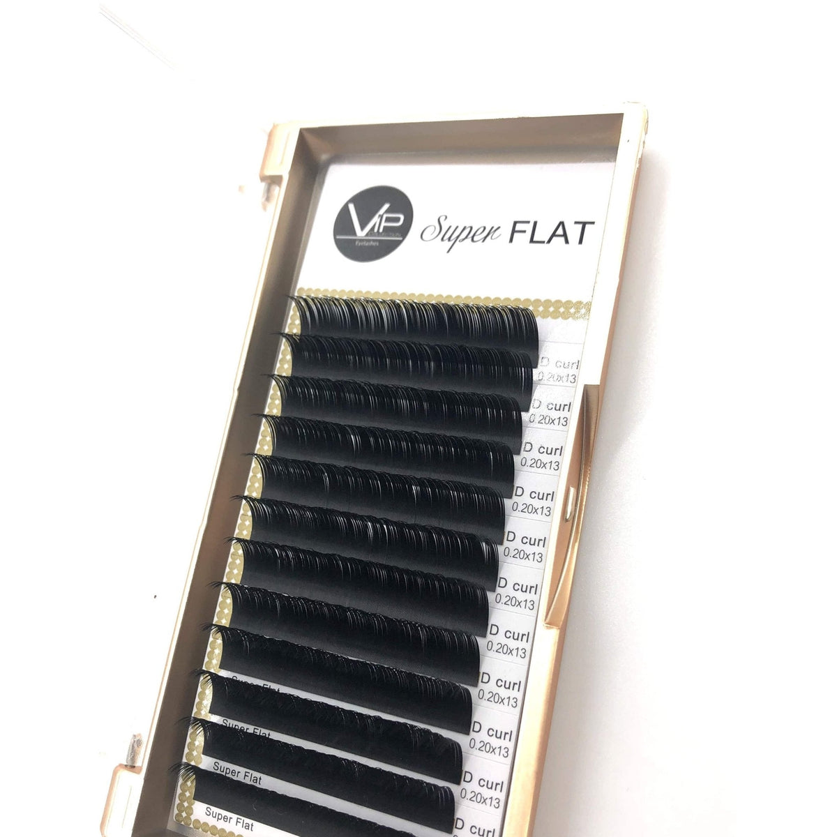 Set of false eyelashes with a gold frame and white label on a white background