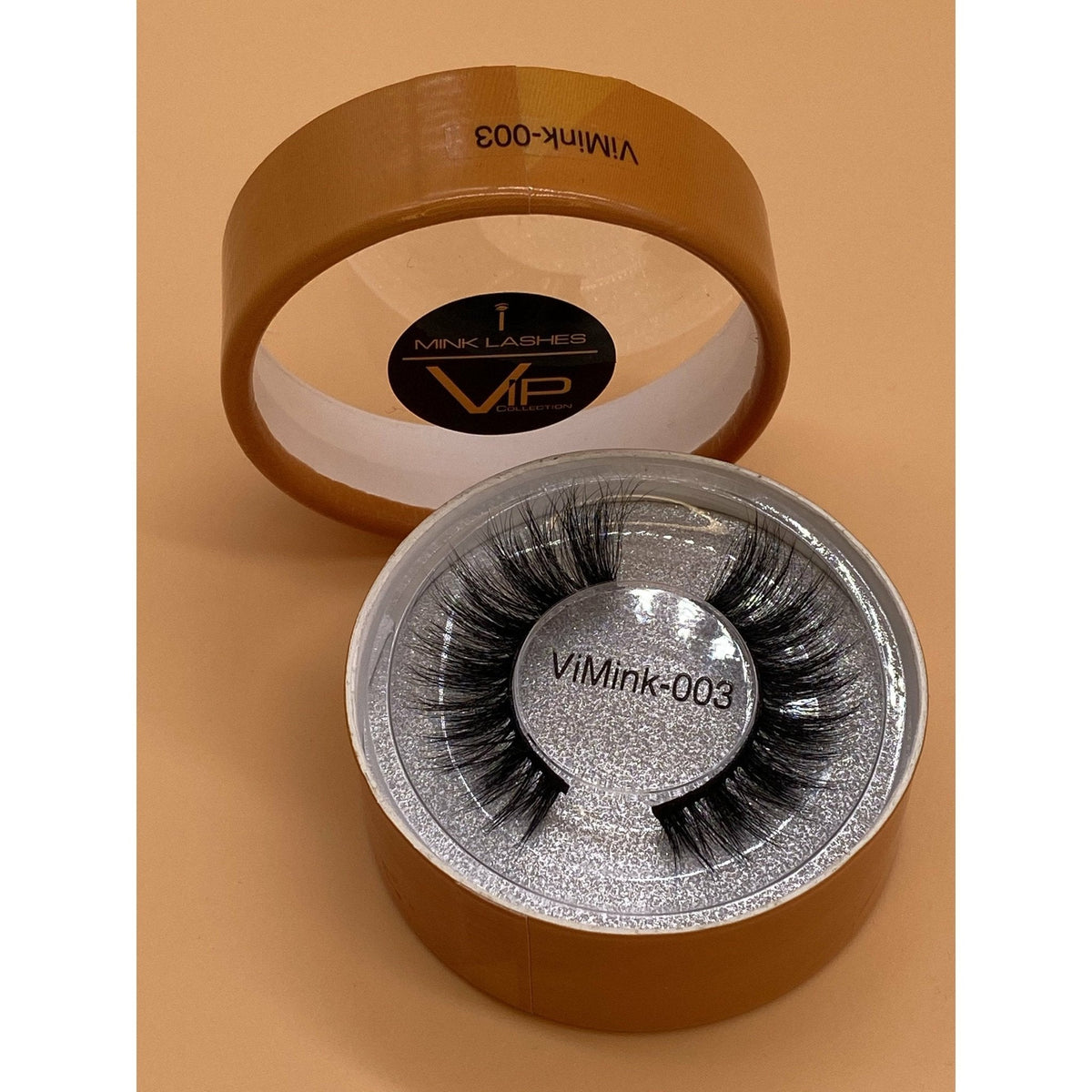 Eyelash packaging with 'ViMink' branding on a beige background