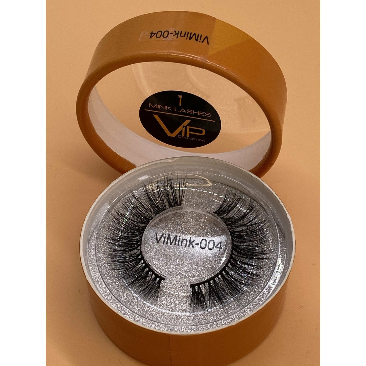 Eyelash packaging with 'ViMink' branding on a beige background