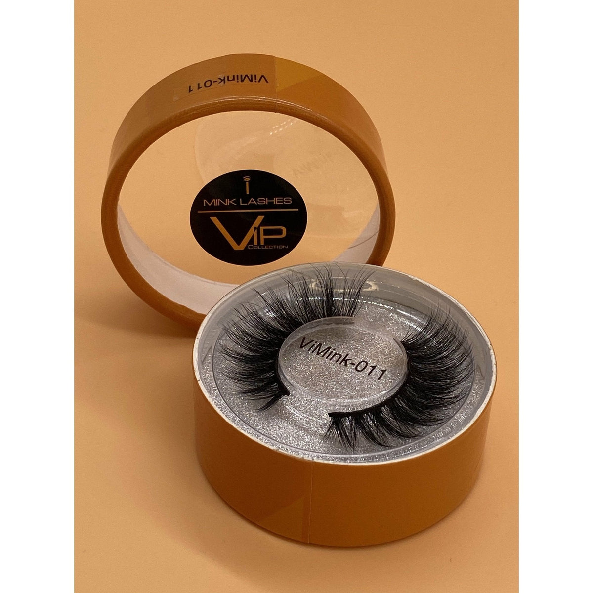 Eyelash packaging with 'VIP Mink Lashes' branding on a beige background